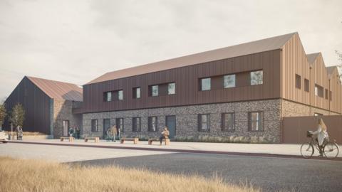 An artist's illustration of a proposed energy research centre in Ayrshire. It is a large building, half brick and half wood panelling. Several people are walking or cycling by.