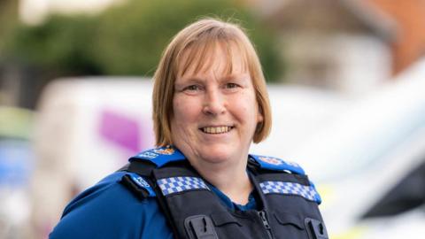 A female police community support officer. 