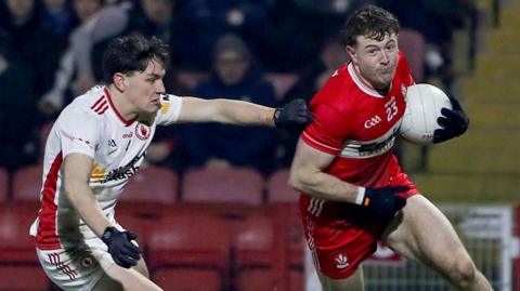 Derry's Lachlan Murray gets past Joey Clarke