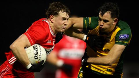  Caolan McClogan tackles Lachlan Murray 