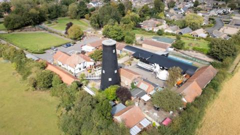 A drone shot of the exterior of Waltham Windmill