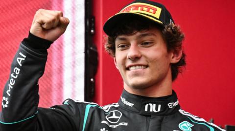 Mercedes' Kimi Antonelli smiles and clenches his right fist in celebration after winning the Belgian Grand Prix