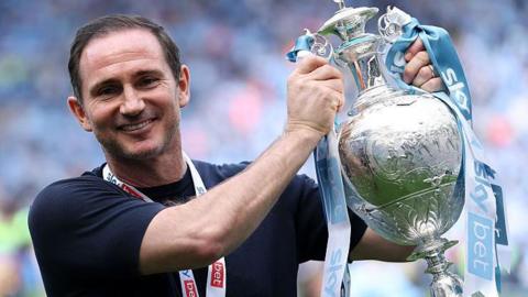 Frank Lampard holds the Championship trophy