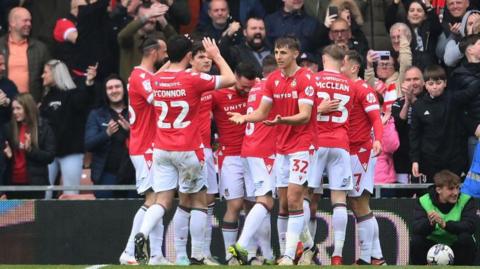 Wrexham celebrate a goal against Stockport