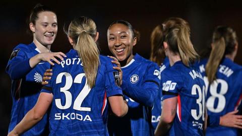 Chelsea women's players celebrate a goal