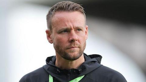 Chris Gunter looks on before a game