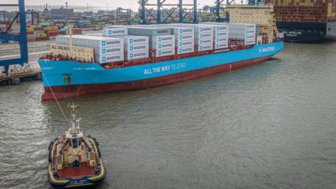 The Laura Maersk connected to a tug boat