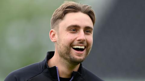 England's Will Jacks laughs during a training session