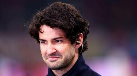 Head shot of Alexandre Pato. He has dark hair and is wearing an earpiece in his left ear