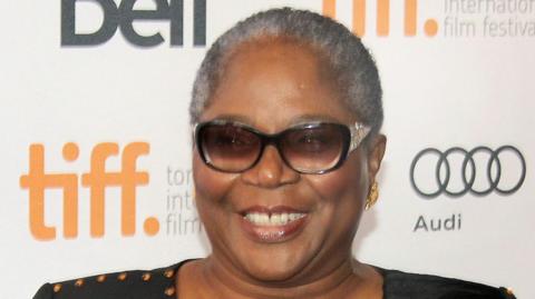 Nigerian singer Onyeka Onwenu poses at a film premiere