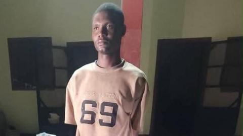 Arrested Nigerian Army Private Mohammed Yusuf wearing a T shirt with 69 written on it