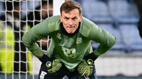 Christian Walton warming up before a game