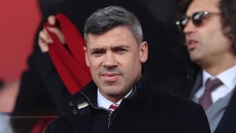 Stoke City sporting director Jonathan Walters looks ahead with a small smile