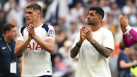 Micky van de Ven and Cristian Romero applaud the Tottenham fans after the final game of the 2025-26 season against Everton