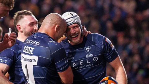 Fitz Harding (right) is congratulated by Bristol Bears team-mates after scoring a try