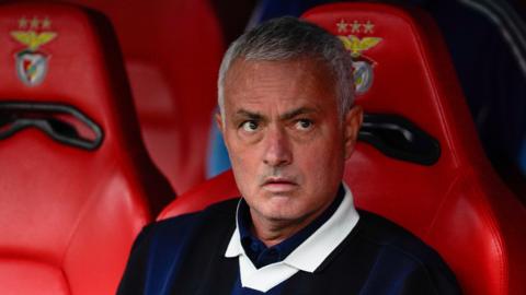 Manager Jose Mourinho sitting in the dugout at Benfica while Fenerbahce boss