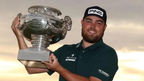 Dan Bradbury celebrates with the Open de France trophy