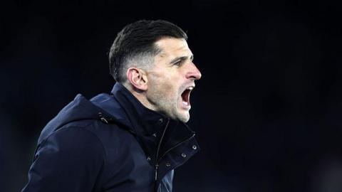 John Mousinho shouting instructions at his players during Portsmouth's match with Leicester City
