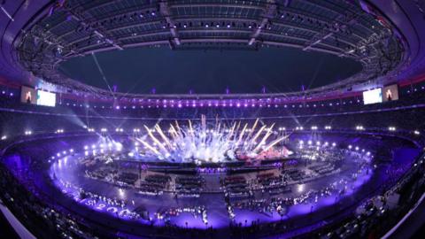 Stade de France lights up for Paralympics closing ceremony