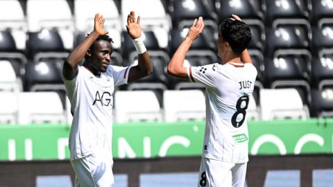 Joseph Opoku (left) celebrates with Elijah Just