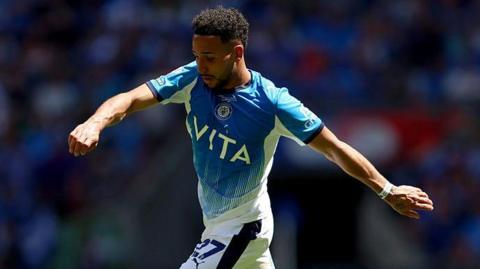 Odin Bailey in action for Stockport County.