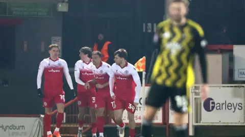 Accrington celebrate Alex Henderson's goal against Salford