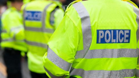 Stock photo of Police in hi-visibility jackets policing crowd control