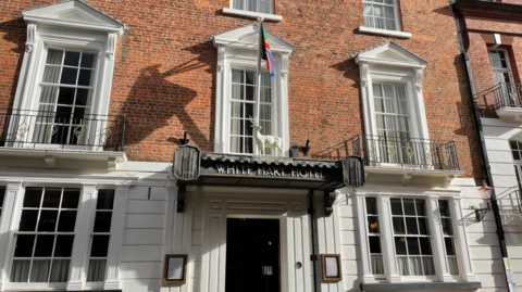 The front door of the White Hart Hotel in uphill Lincoln