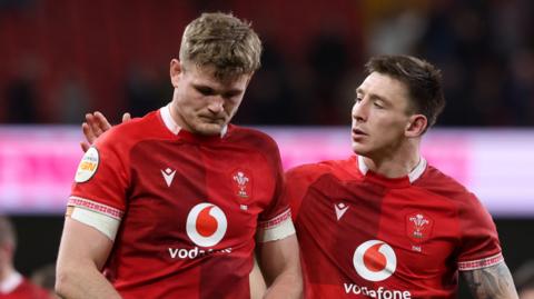 Josh Adams of Wales consoles teammate Taine Plumtree following the Six Nations 2026 match between Wales and France