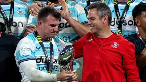 Ben Spencer (left) and Johann van Graan (right) on the podium with the European Challenge Cup trophy 
