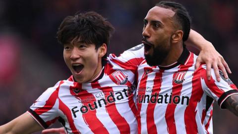 Sorba Thomas (right) celebrates his equaliser against Norwich