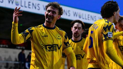 Dylan Morgan celebrates his stoppage time goal that rounded off the victory