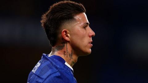 Enzo Fernandez side view close-up of head and shoulders as he wears blue Chelsea shirt