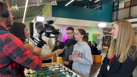 A group of young people speak to the BBC in Bolton about their thoughts on a social media ban for under-16s