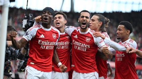 Martin Zubimendi celebrates scoring his team's first goal with teammates Noni Madueke, Mikel Merino, Riccardo Calafiori and Ethan Nwaneri.