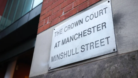 Close up of a sign outside the building of Manchester Crown Court Minshull Street