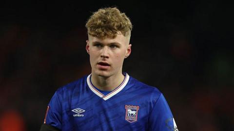 Sindre Walle Egeli in an a blue Ipswich Town shirt