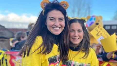 Amy Garcia and Lindsey Burrow smile and look at the camera 