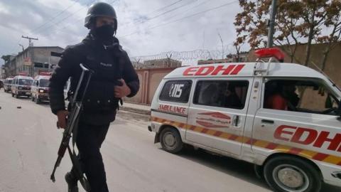 armed soldier and ambulance in Quetta after deadly attack