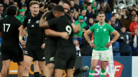 Johnny Sexton stands with hands on hips after Ireland's World Cup quarter-final defeat to New Zealand