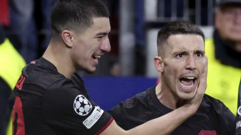 Alejandro Grimaldo of Bayer 04 Leverkusen celebrates 2-2 with Christian Kofane of Bayer 04 Leverkusen