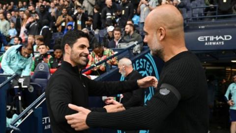 Mikel Arteta embracing Pep Guardiola