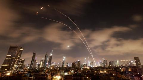 Israeli air defence systems are activated to intercept Iranian missiles over the Israeli city of Tel Aviv early on June 18, 2025.