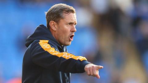 Paul Hurst shouts instructions from the touchline during a game