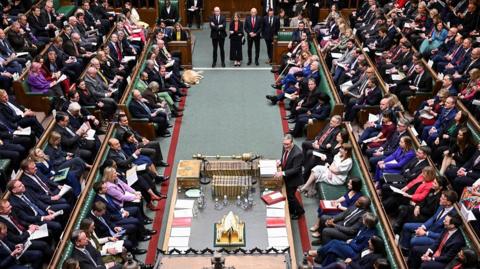 A wide angle shot of the House of Commons during Prime Minister's Questions