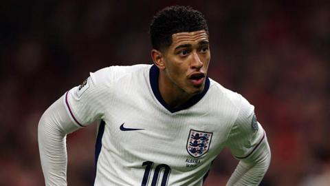 Jude Bellingham leans forward with his hands on his hips while playing for England against Albania in the 2-0 European World Cup qualifier victory in November 2025