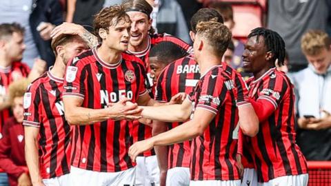 Walsall players celebrate a goal