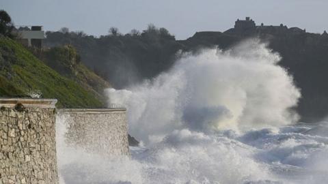 Large waves caused by the arrival of Storm Ingrid strike land at Gyllyngvase Beach on January 23, 2026 in Falmouth, Cornwall,