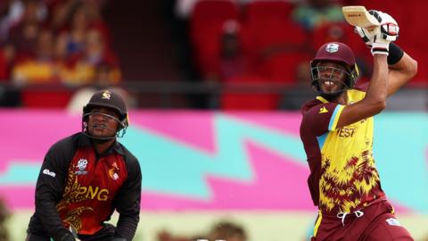 West Indies' Roston Chase plays a shot against Papua New Guinea