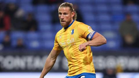 Alfie Kilgour during a match for Mansfield